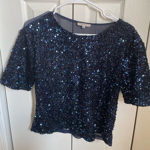 Beautiful blue sequins shirt, back in sheer, size medium.
